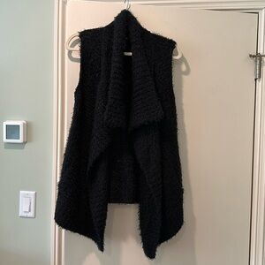 Never worn! Black sleeveless sweater. Womens Size small.